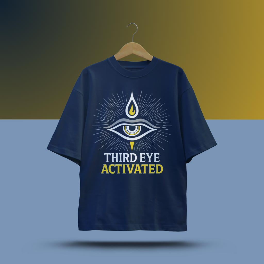 Navy blue t-shirt with 'Third Eye Activated' design on a hanger against a gradient background