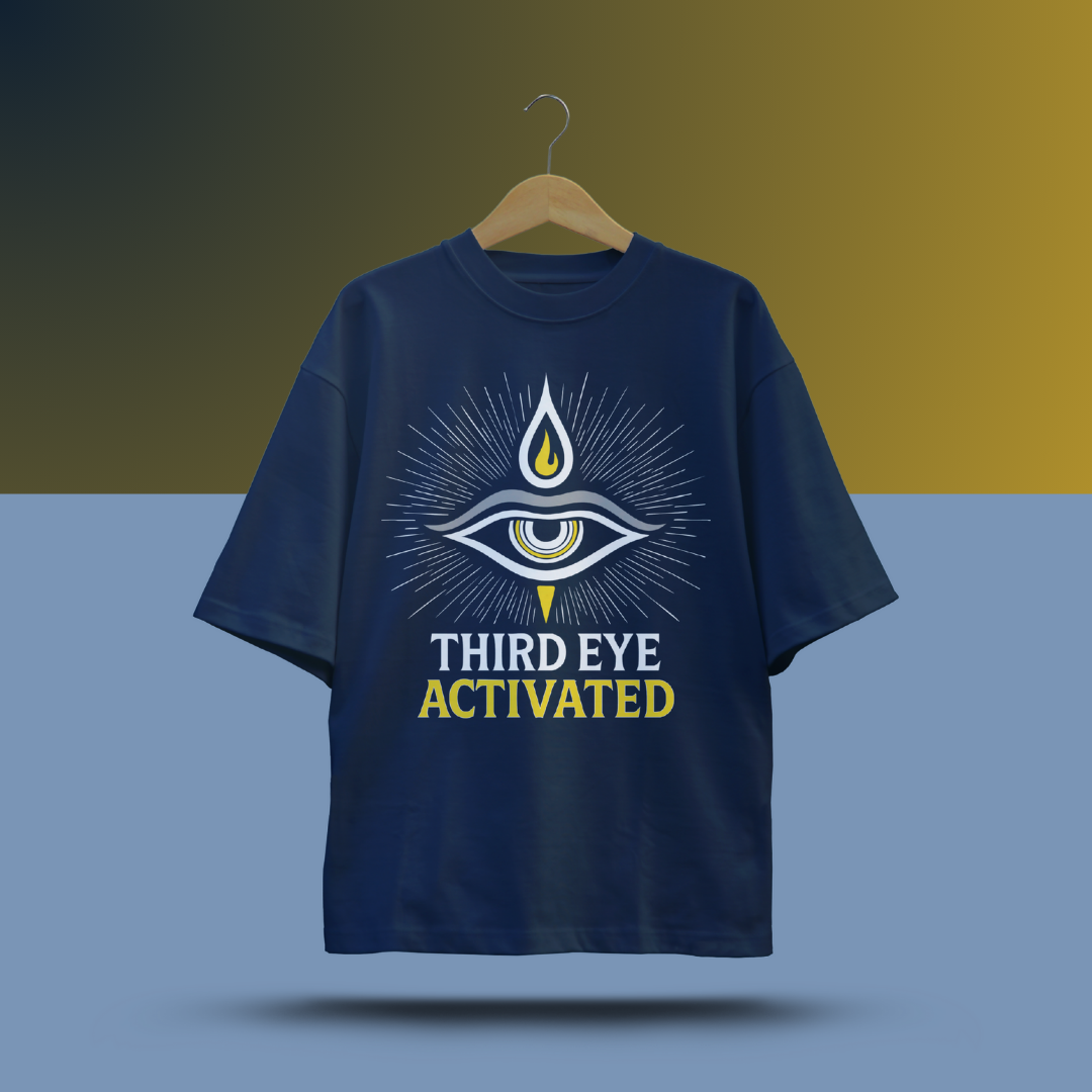 Navy blue t-shirt with 'Third Eye Activated' design on a hanger against a gradient background