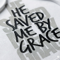 Text 'HE SAVED ME BY GRACE' on a white background