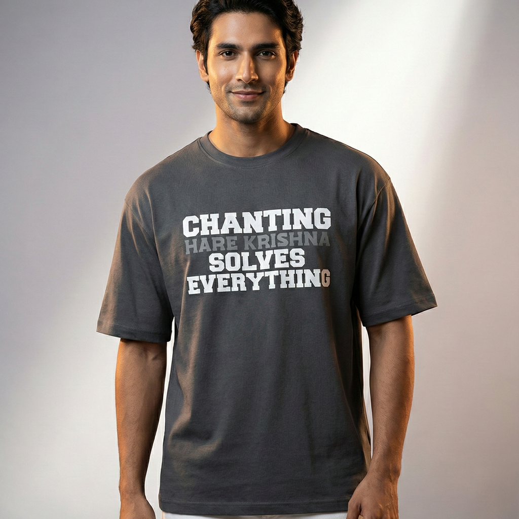 Man wearing a t-shirt with text 'CHANTING HARE KRISHNA SOLVES EVERYTHING' on a gray background